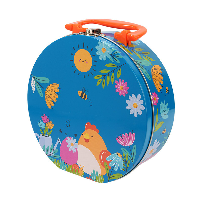 Valise Métallique "Alphonse et Ernestine" : Valise ronde métallique apte au contact alimentaire. Emballage pratique et élégant pour présenter ou offrir vos chocolats de Pâques.