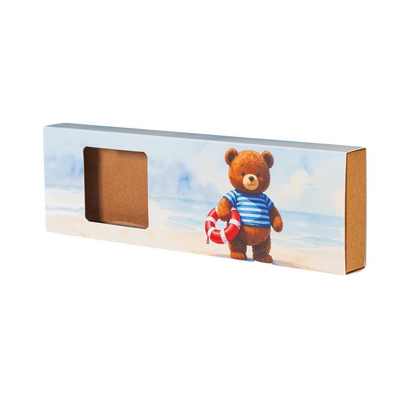 Boîte Oursons Petit Marin : Conçue pour recevoir 8 oursons en guimauve, intérieur kraft, fenêtre transparente, illustration Ourson Petit Marin pour une présentation sympa et gourmande.